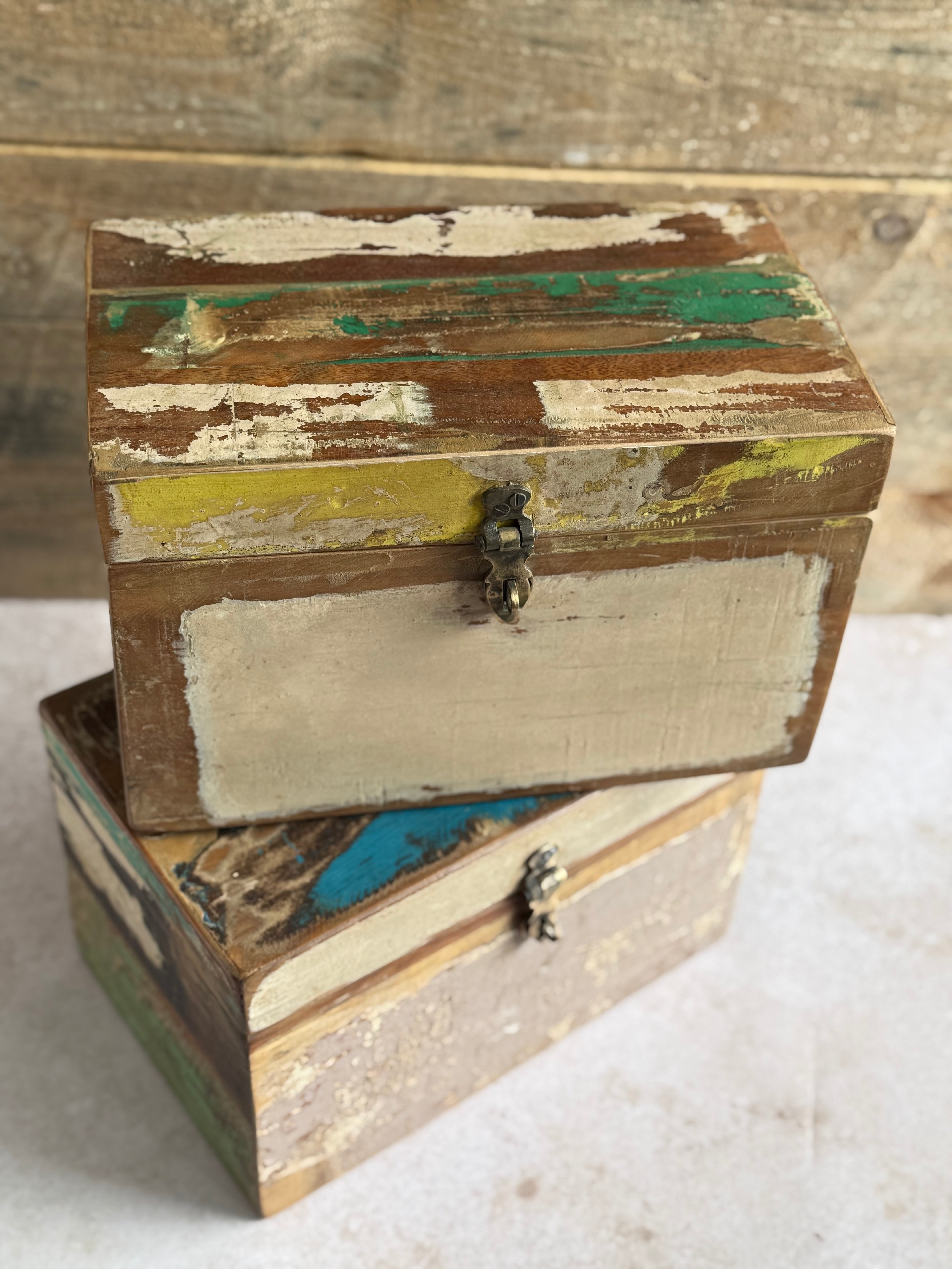Two reclaimed scrapwood boxes on a neutral background