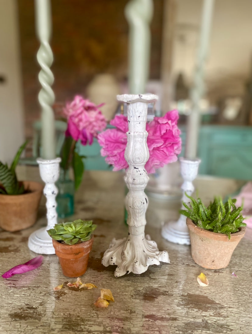 white cast iron candle holder