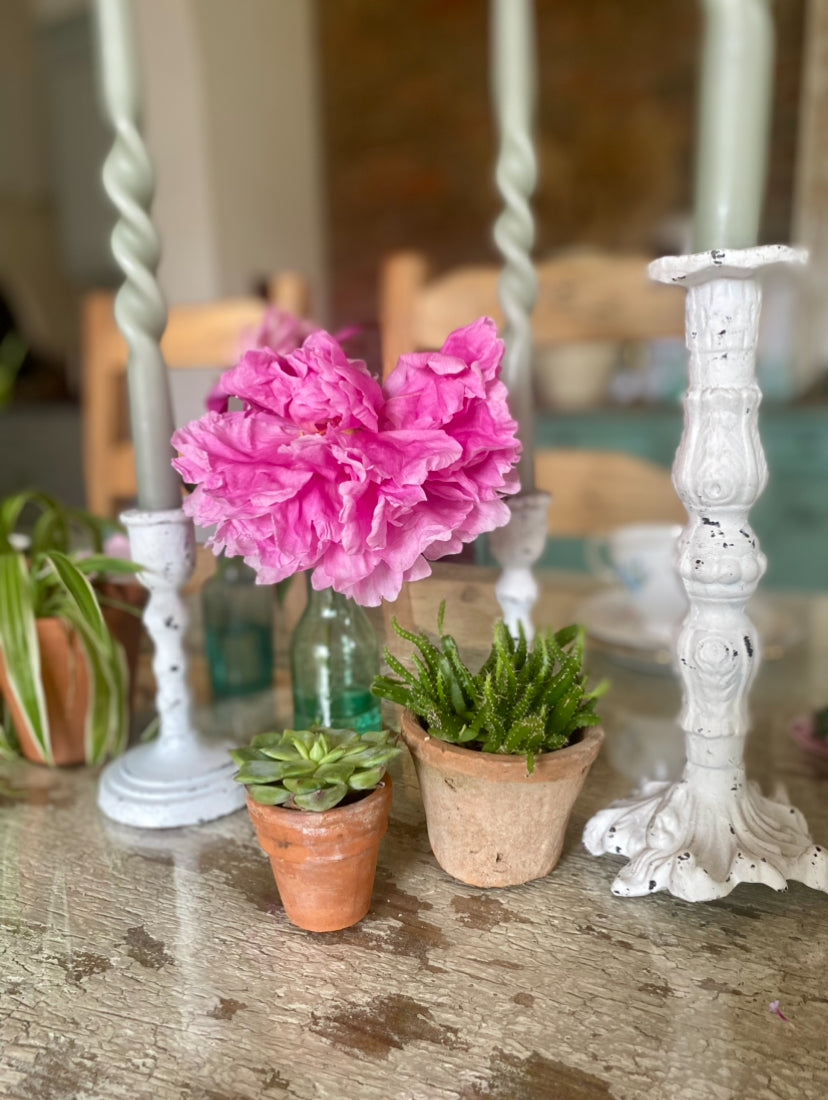 white cast iron candle holder