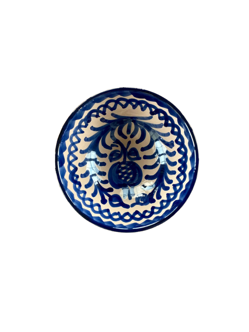 Handmade traditional Spanish ceramic bowl with blue and white colors and floral patterns.
