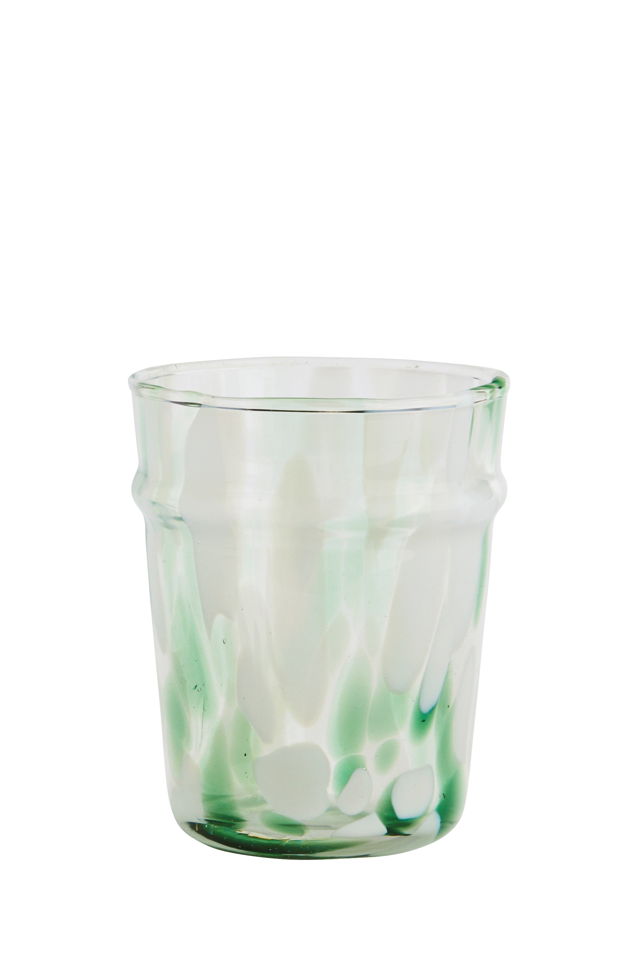 drinking glass with green and white splatter design