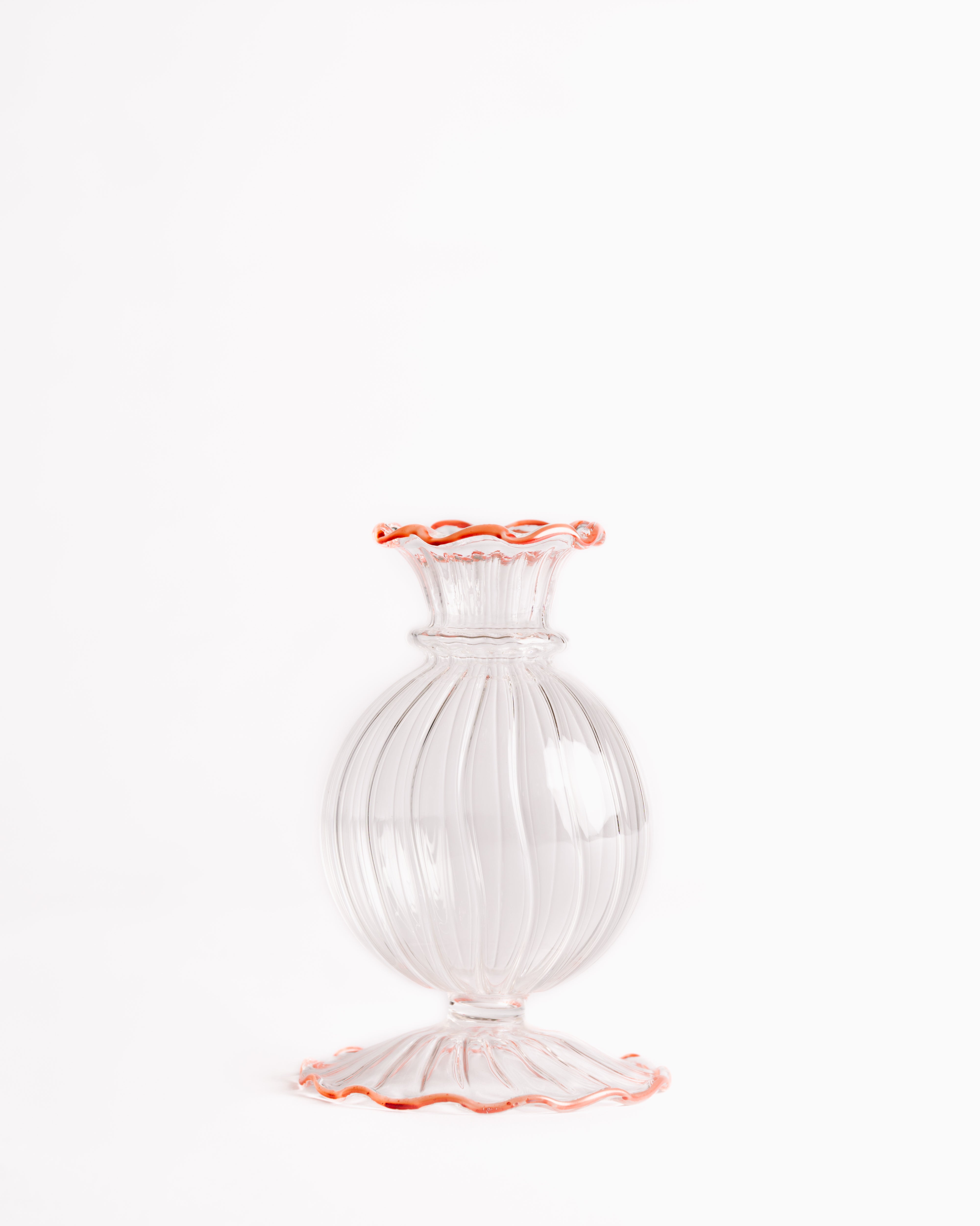 Frilly edge glass bud vase with swirling pattern and tangerine rim