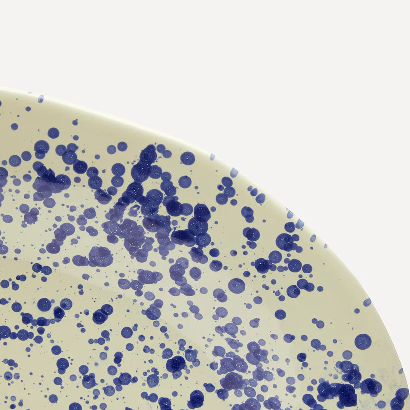 Close up detail of a blue splatter platter