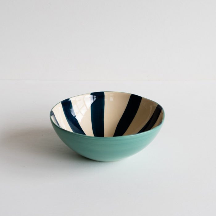 teal cereal bowl with blue striped interior