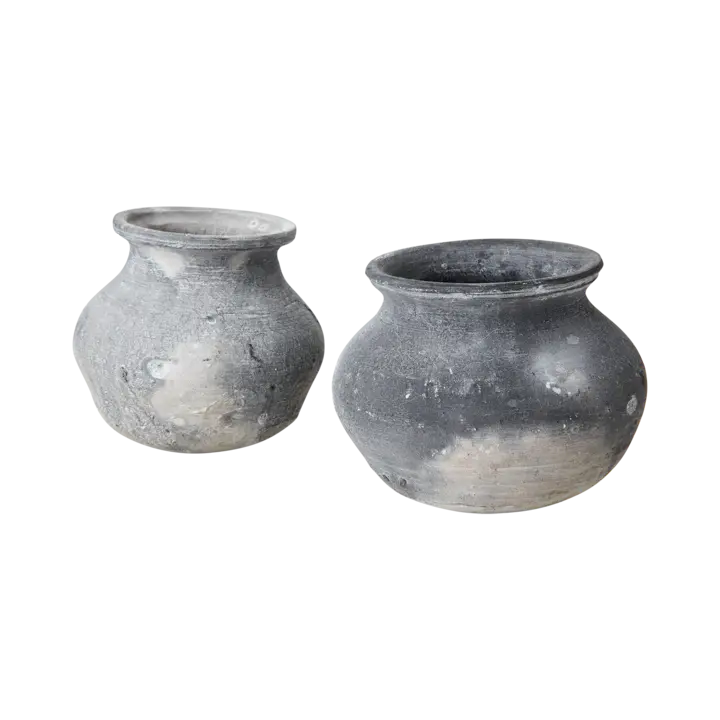 Two gray clay pots on a clear background