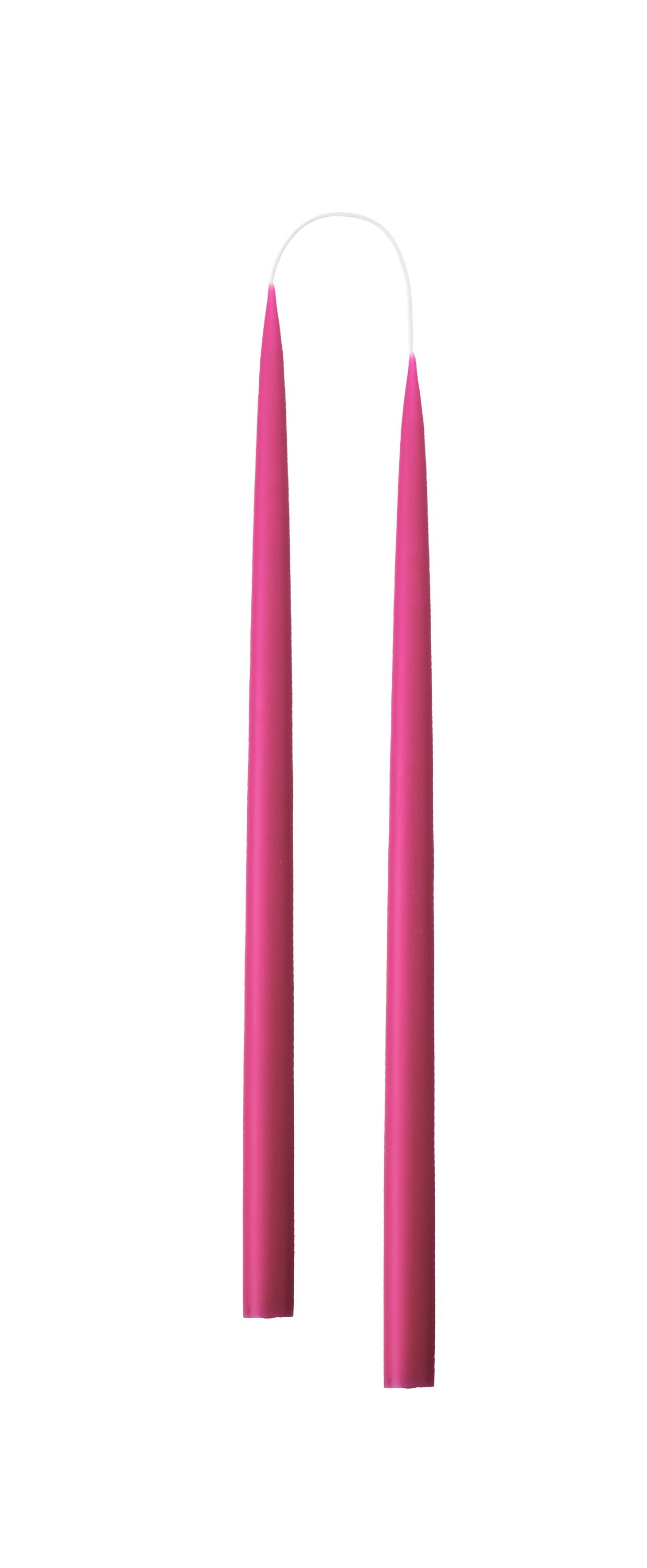 Two cerise pink candles on a white background