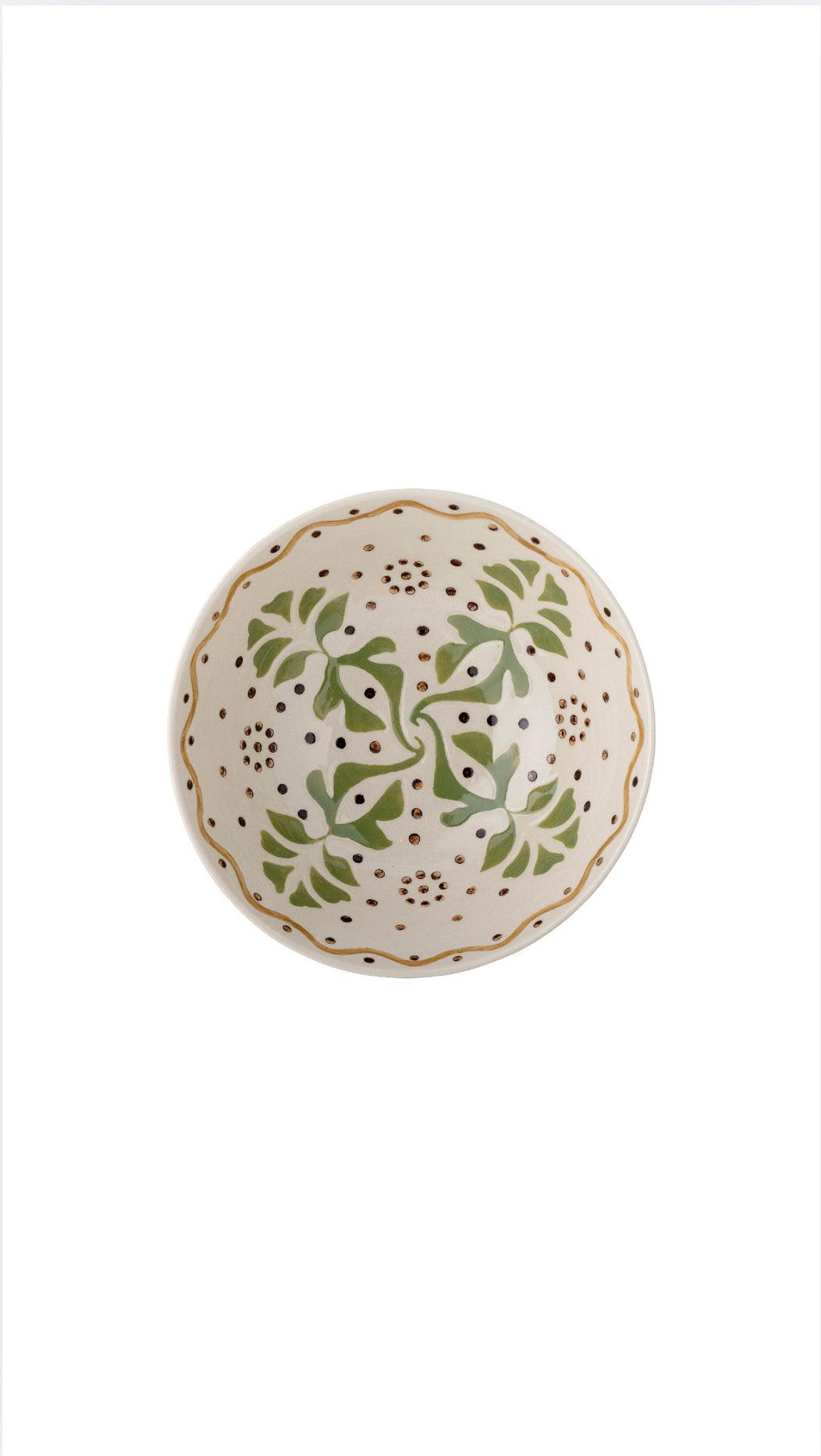 Decorative ceramic bowl with green floral patterns on a white background