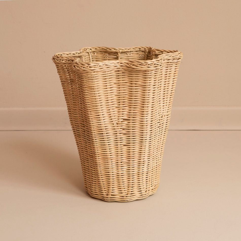 Large rattan wavy vase on beige background