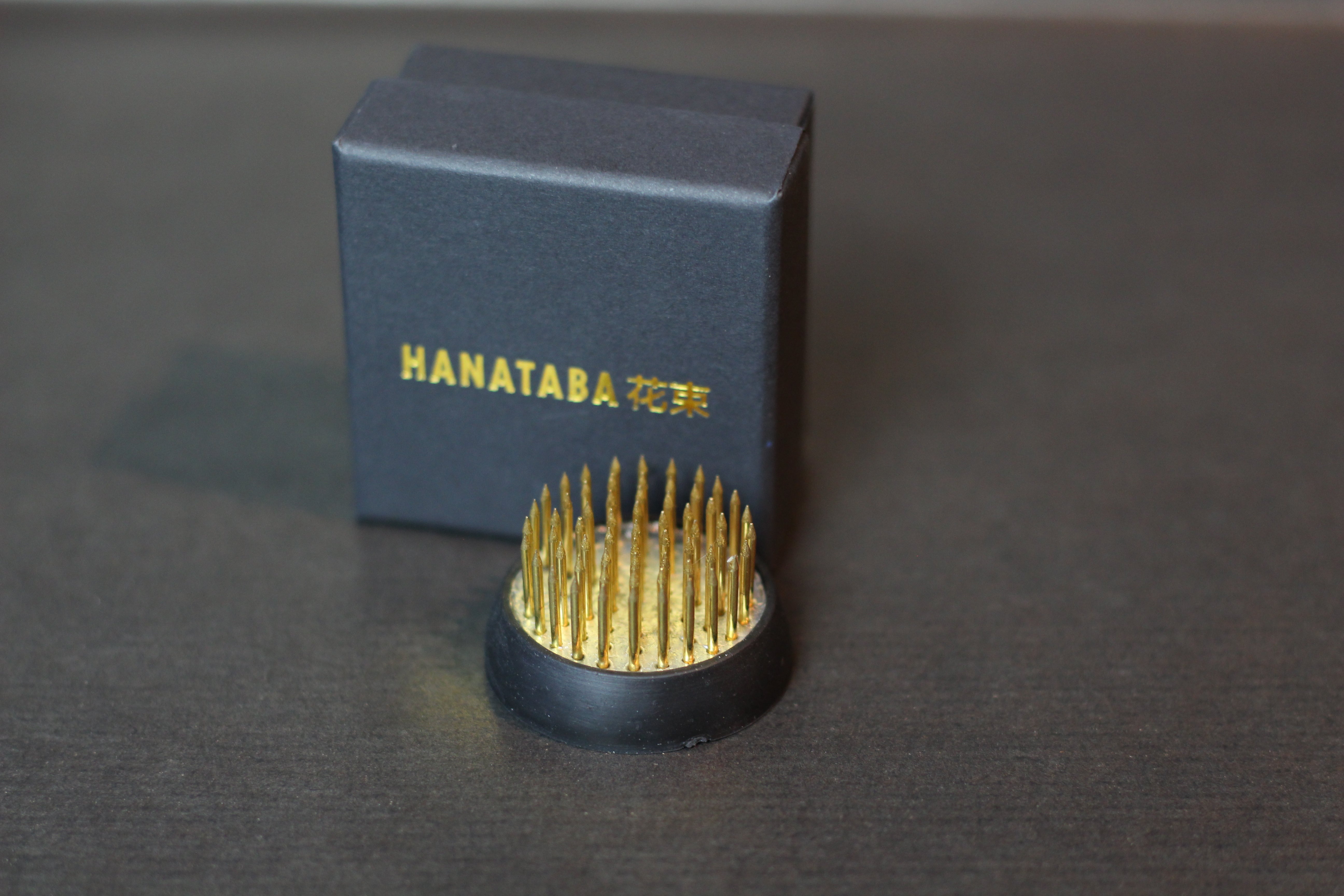 Small metal flower frog with black gift box