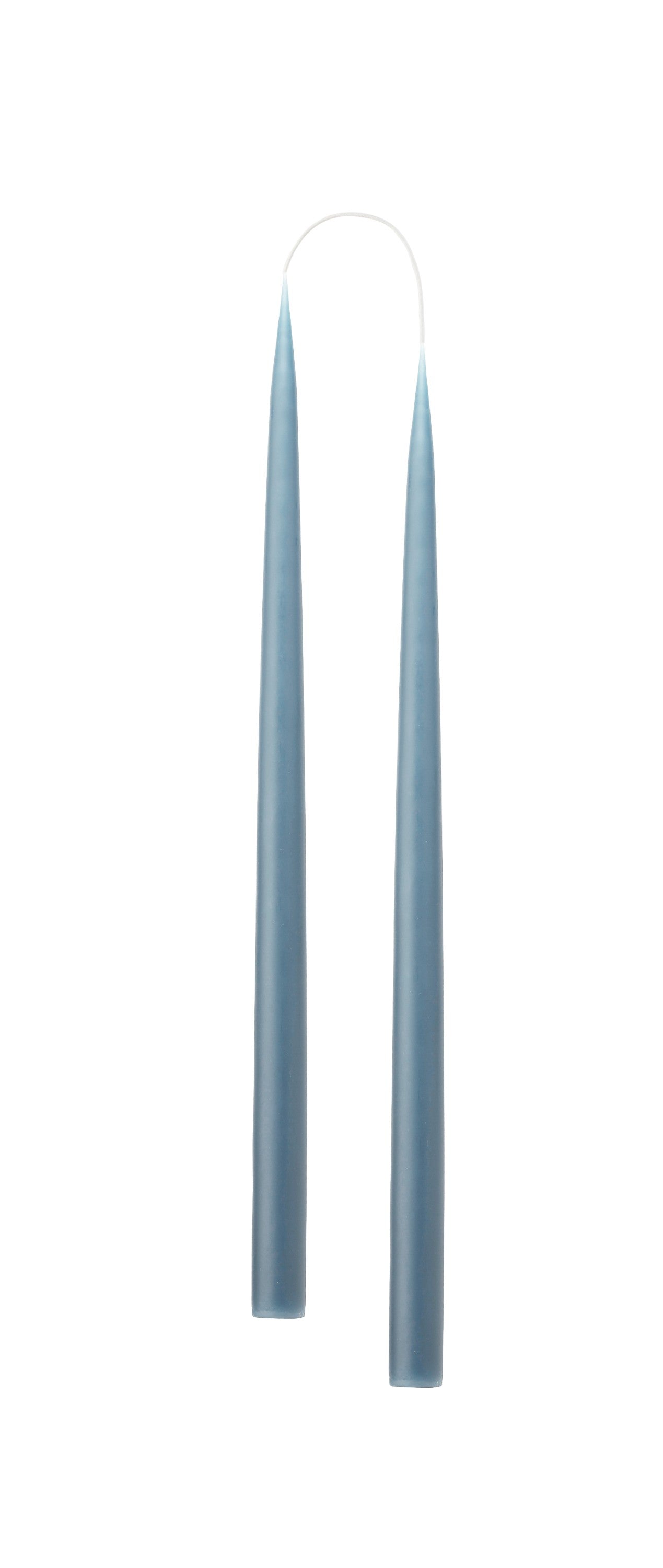 Two long, tapered storm blue candles on a white background
