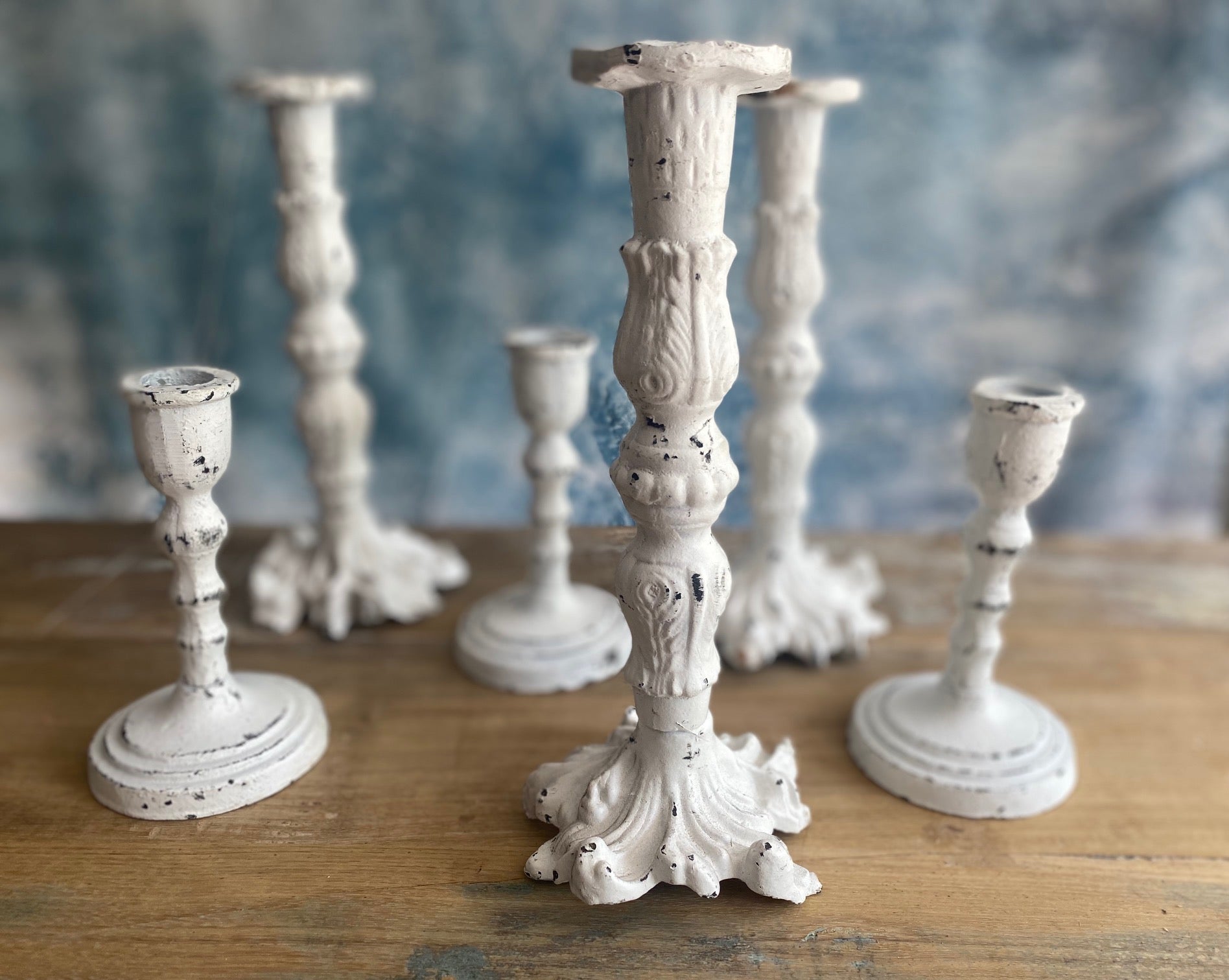 white cast iron candle holder