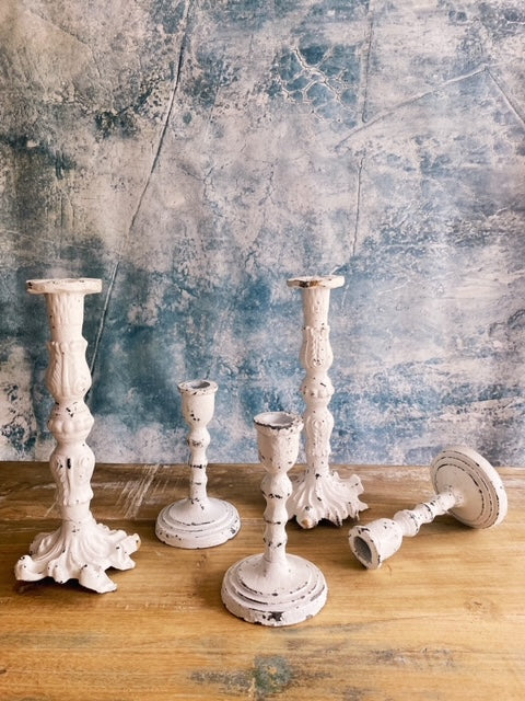 white cast iron candle holder