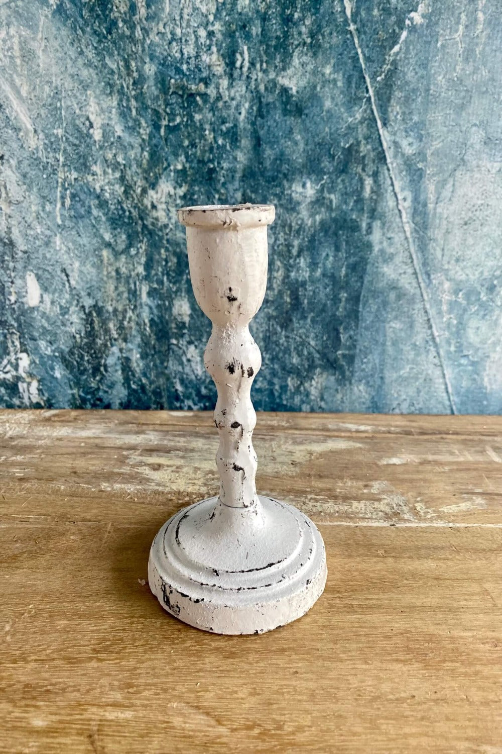 white cast iron candle holder