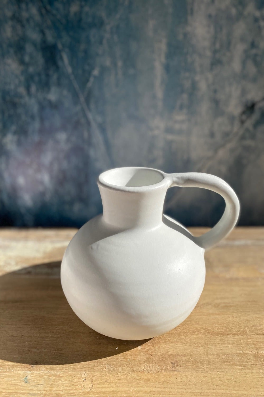 Matte white stoneware vase with handle from Day Home at Amber and Willow