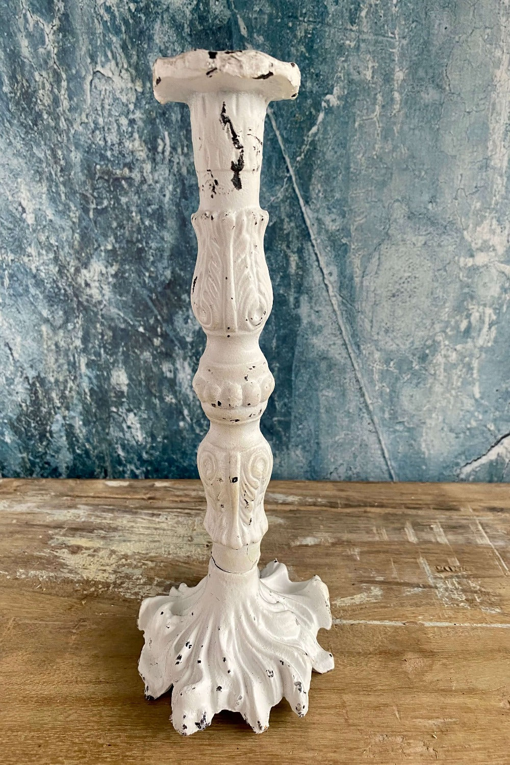 white cast iron candle holder