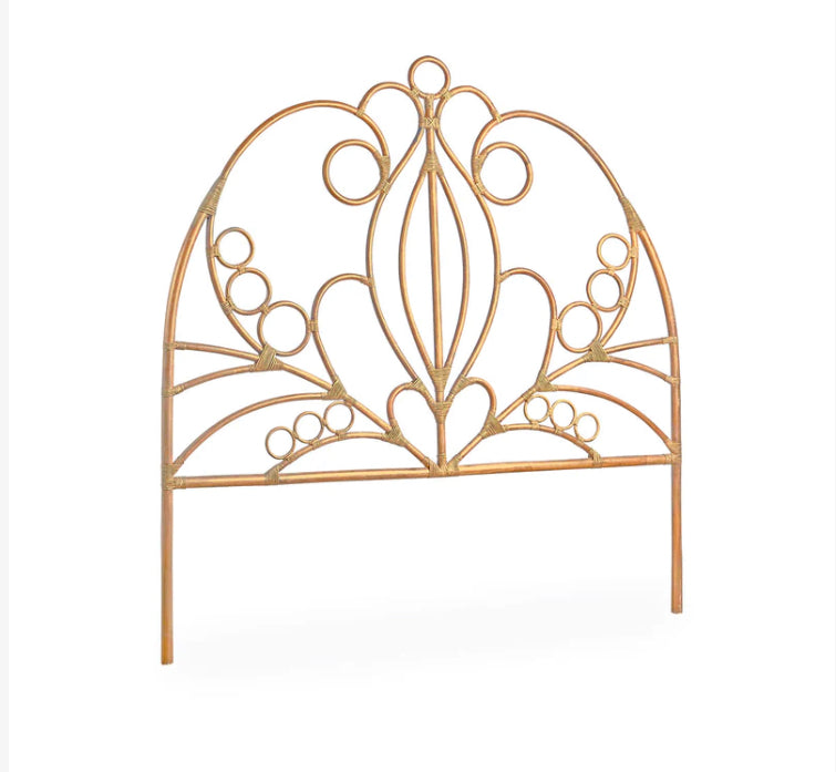 A rattan scrolled headboard made in Indonesia