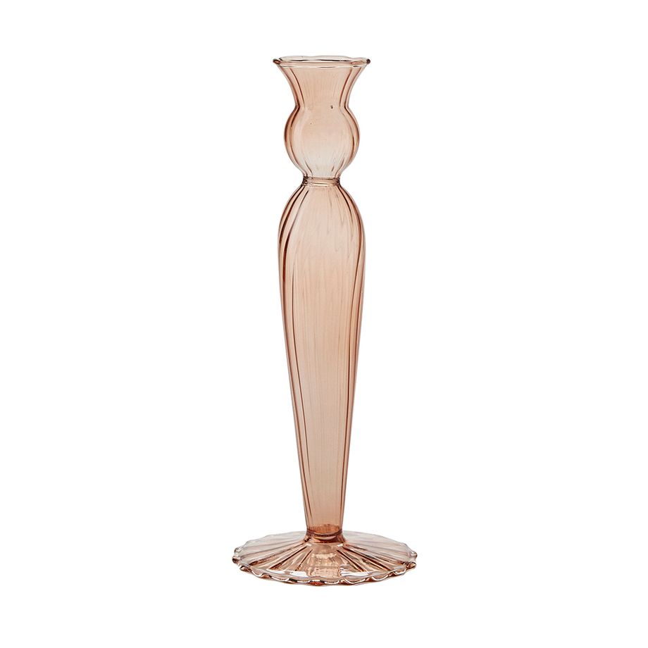 Cut out of rust glass fluted candle holder against white background