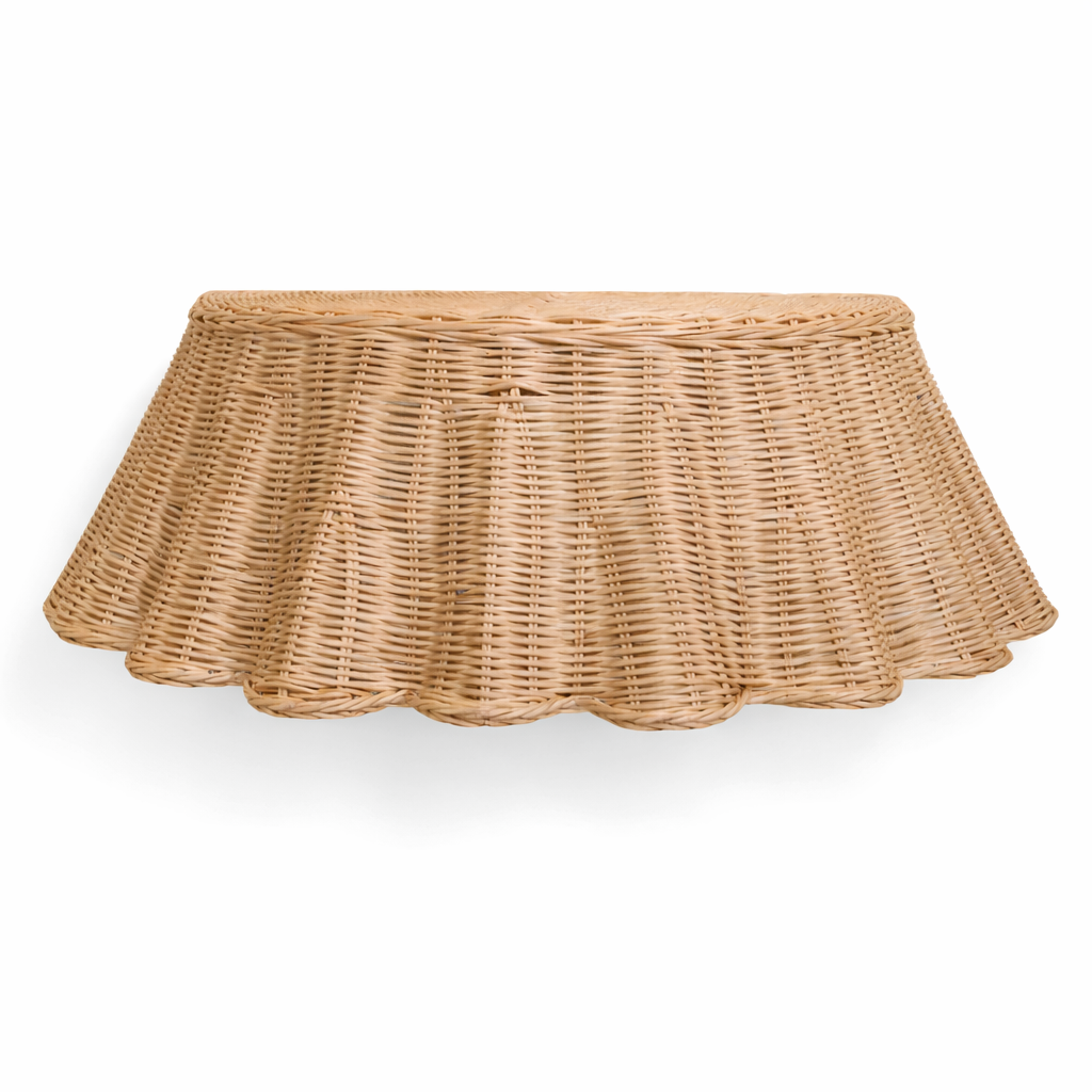 Floating rattan skirted console table against white background. 