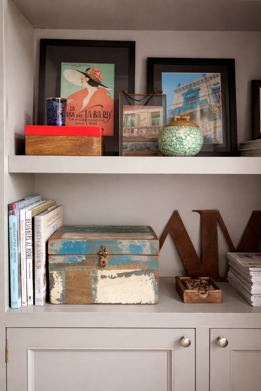 Bookshelves with reclaimed wood box, books and decorative elements 