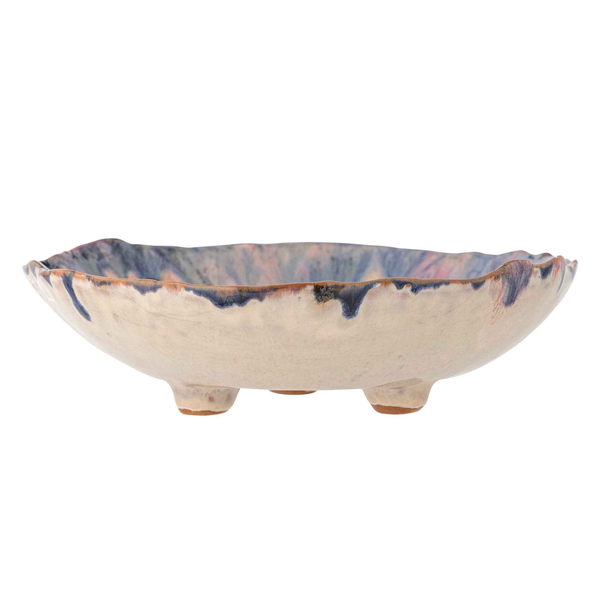 Side view of Watercolour Footed Bowl with cream outer finish on three small feet with blue glaze dripping over the side against a white background