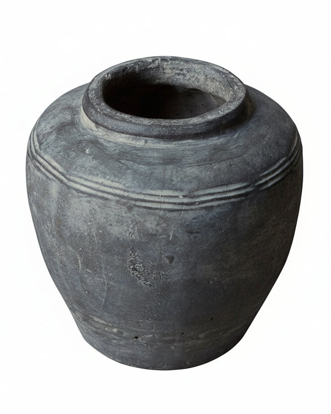 Cut out of grey cement vessel against white background