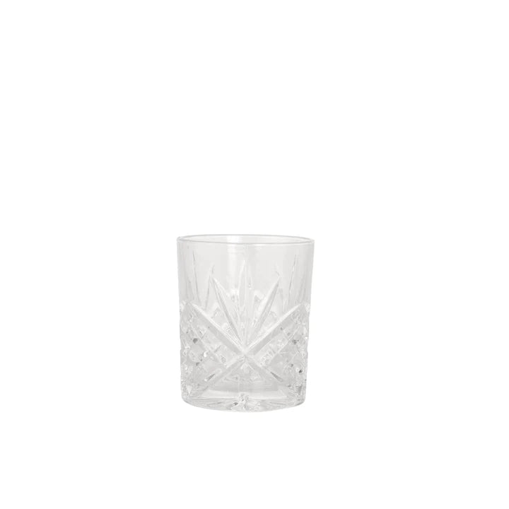 Cut glass tumbler on white background