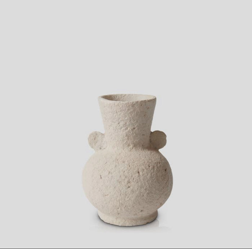 Creamy textured curvy vase on white background