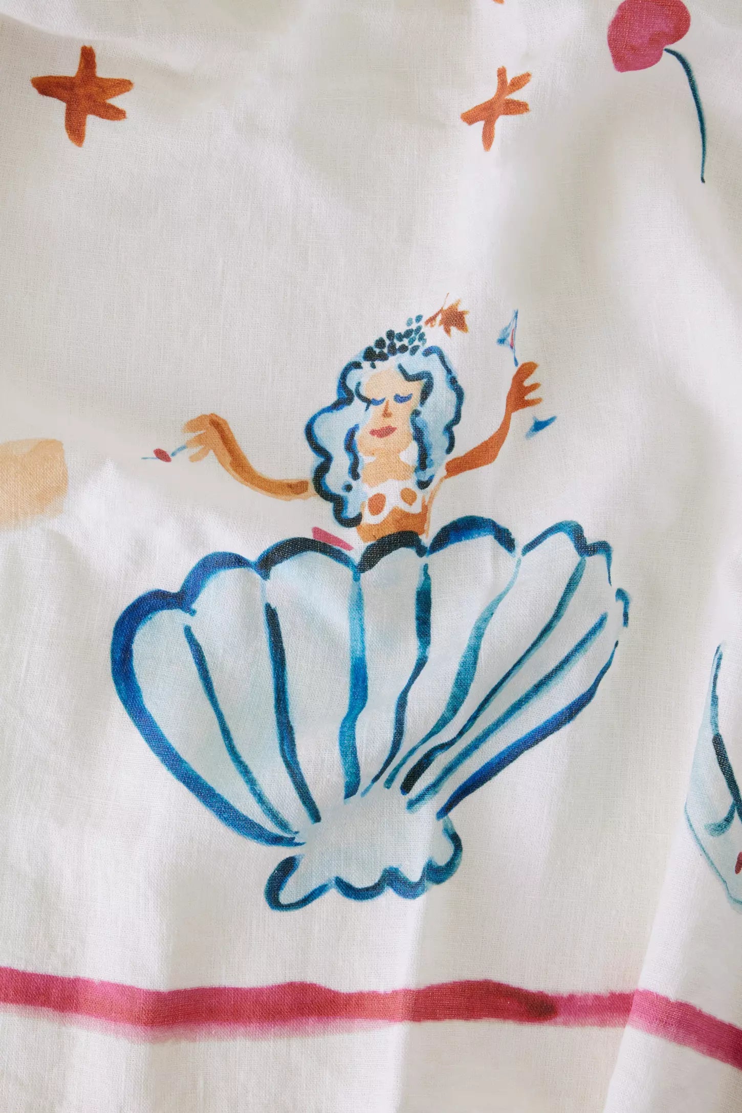 Whimsical hand painted mermaid illustration on tablecloth at Amber  Willow