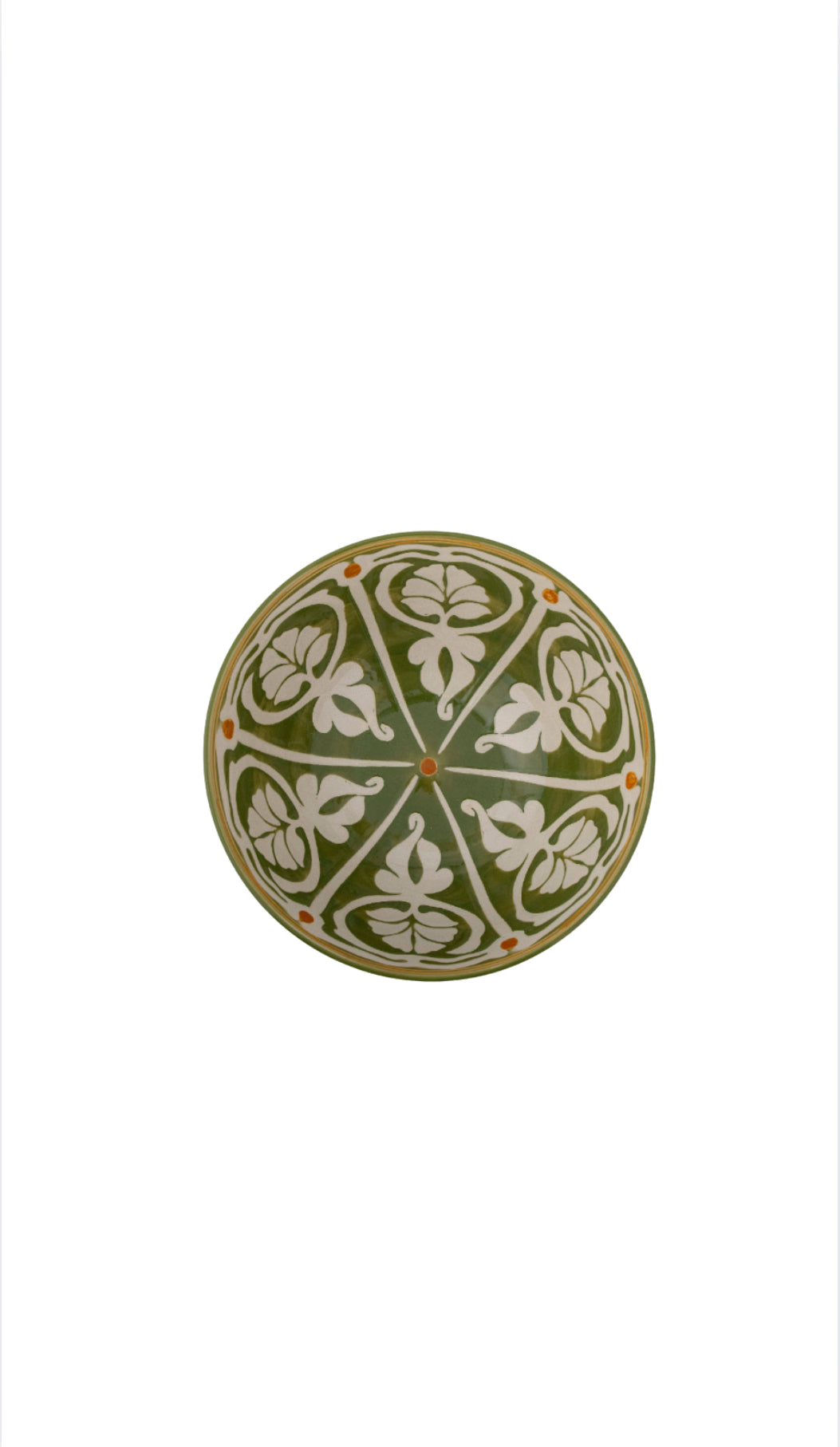 Aerial view of Hand-painted stoneware bowl in olive and ochre tones styled on white background