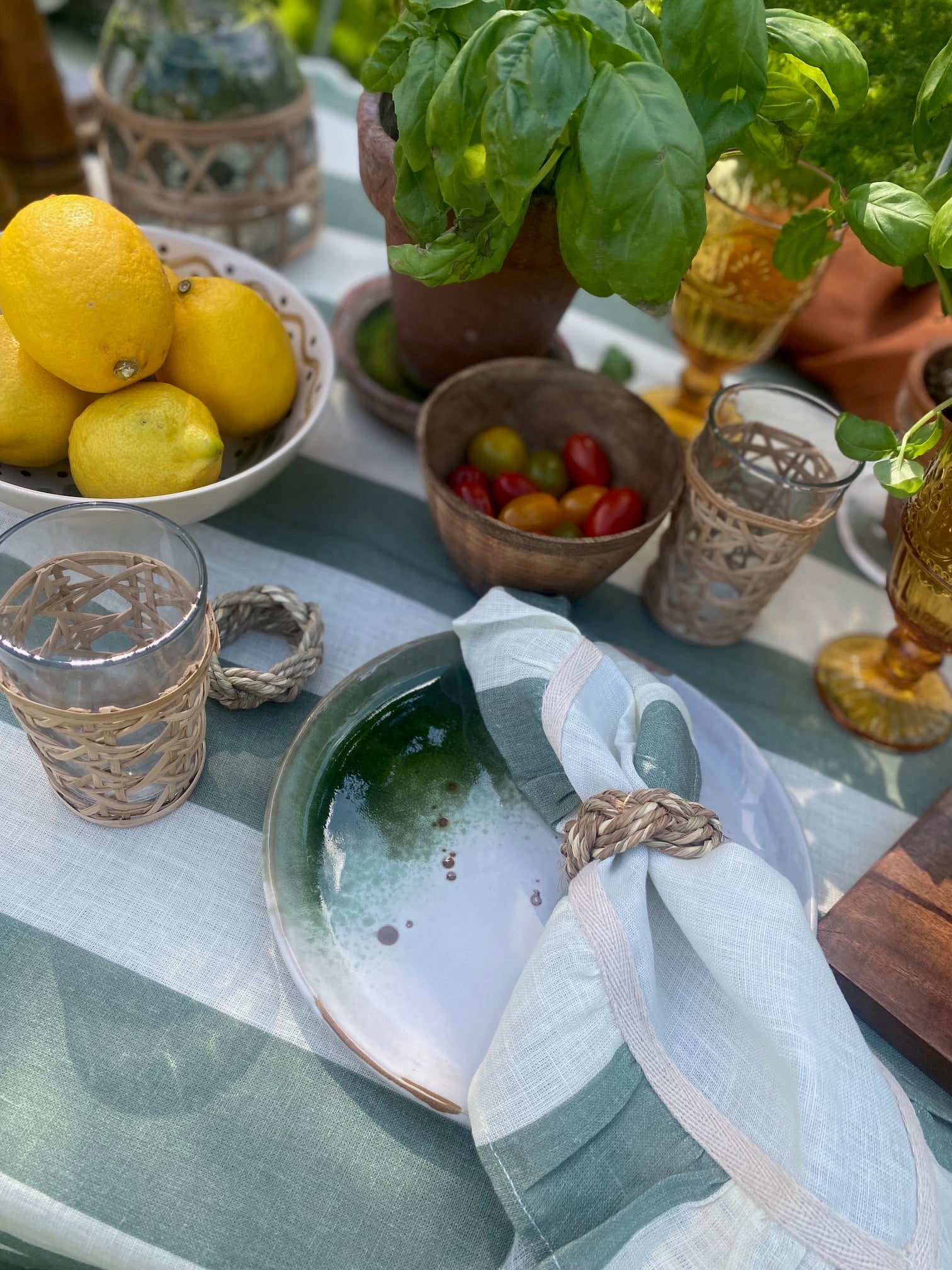 Seagrass napkin rings styled on a Portofino tablescape with linen napkins