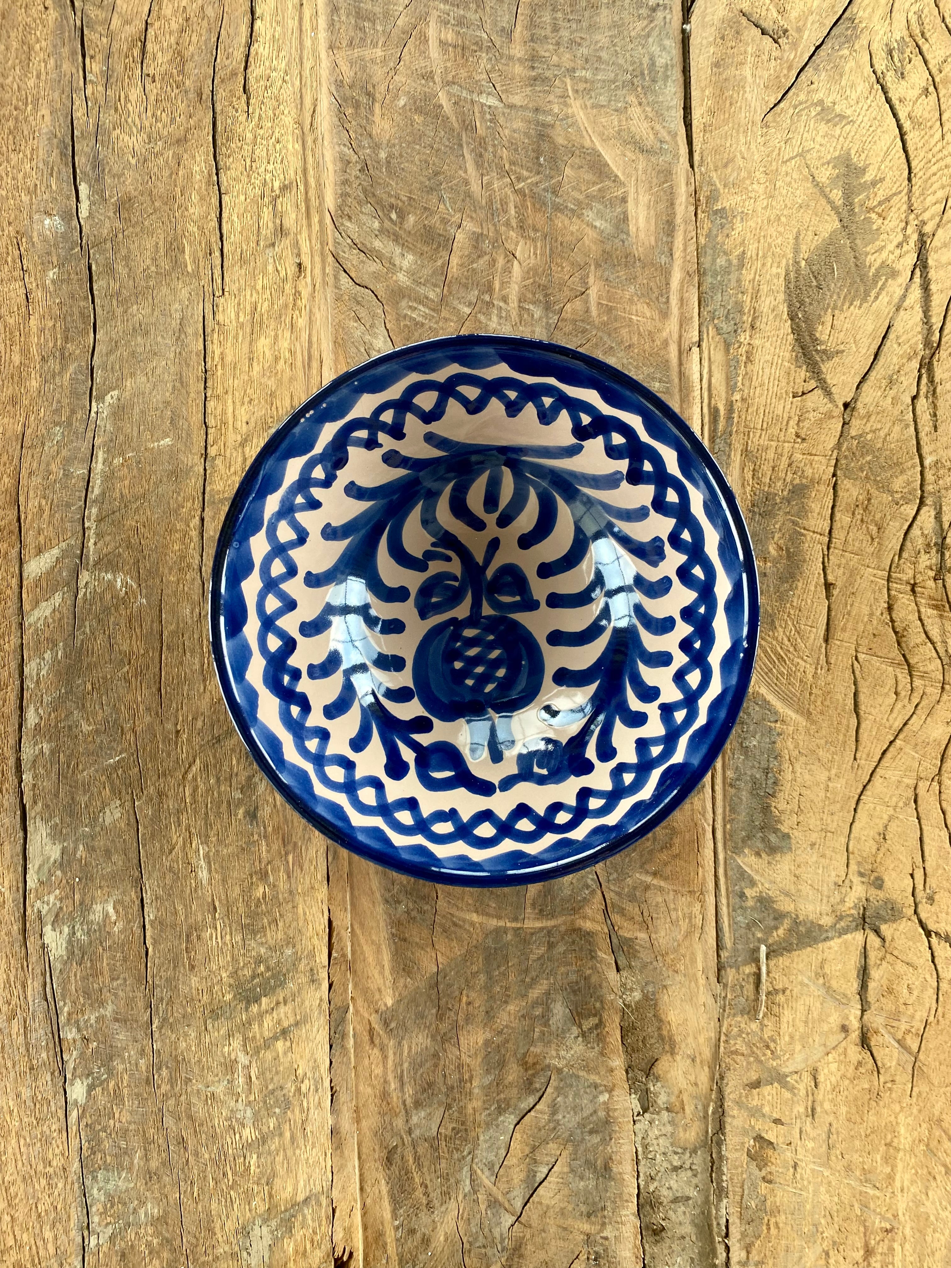 Spanish bowl with blue motif on rustic table