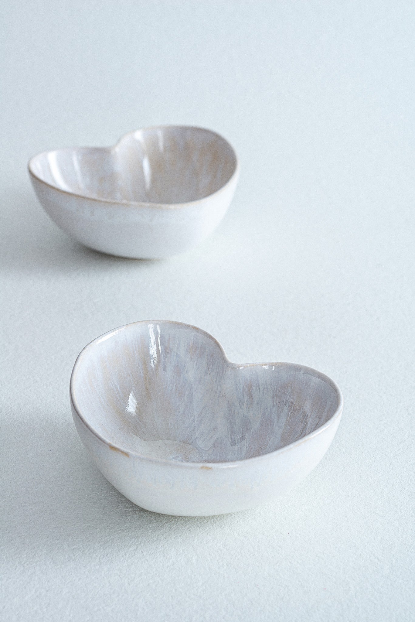heart shaped ceramic bowl with white washed glaze
