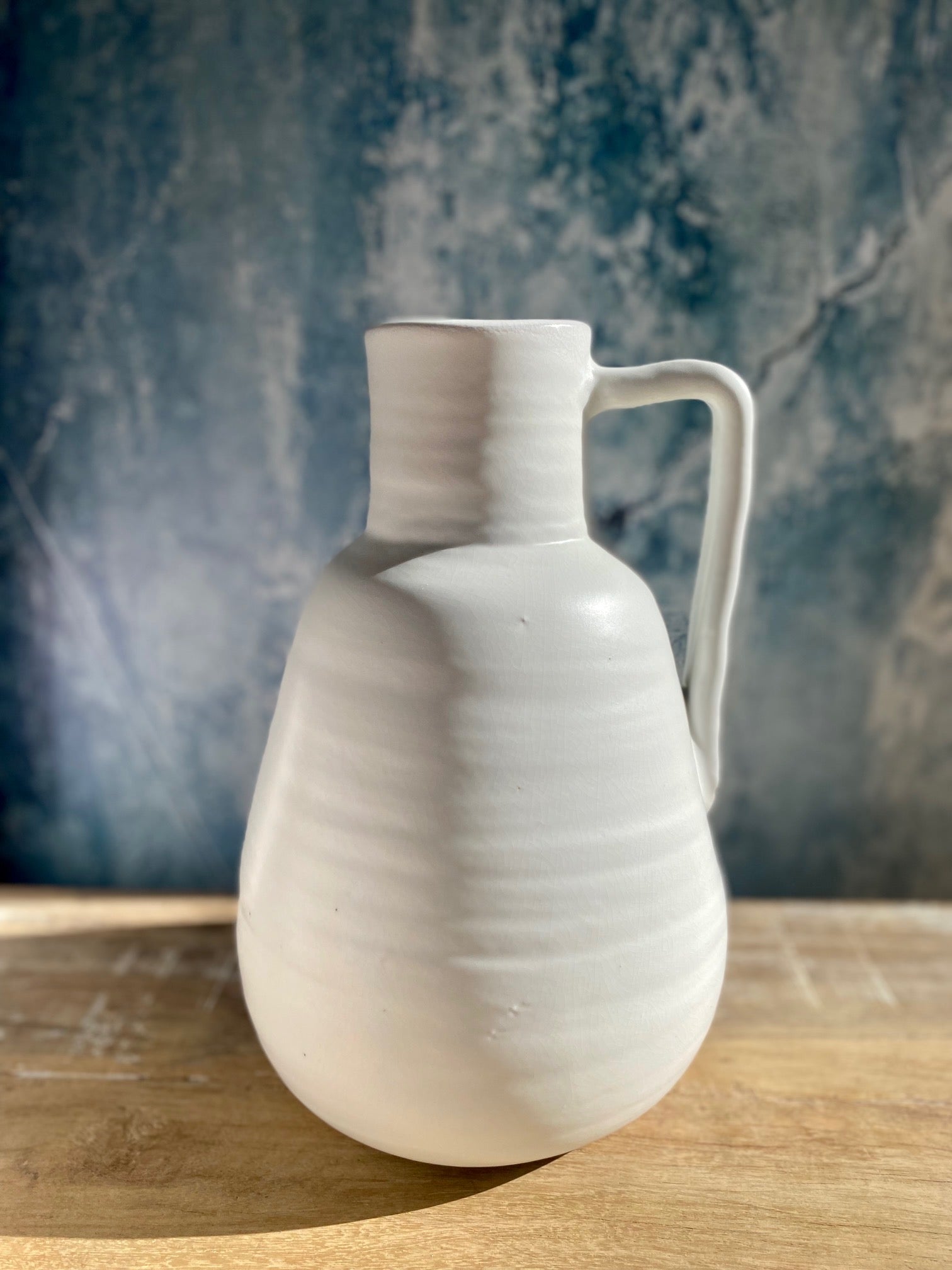 Matte white stoneware vase with handle from Day Home at Amber and Willow