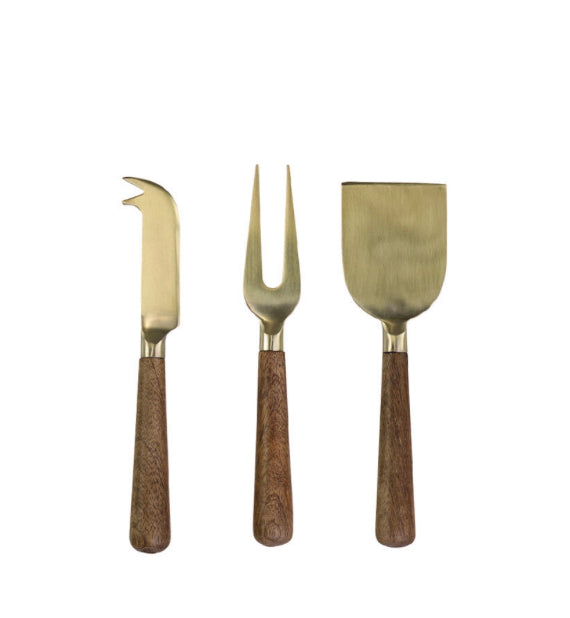 Brass cheese knives with wooden handles on white background