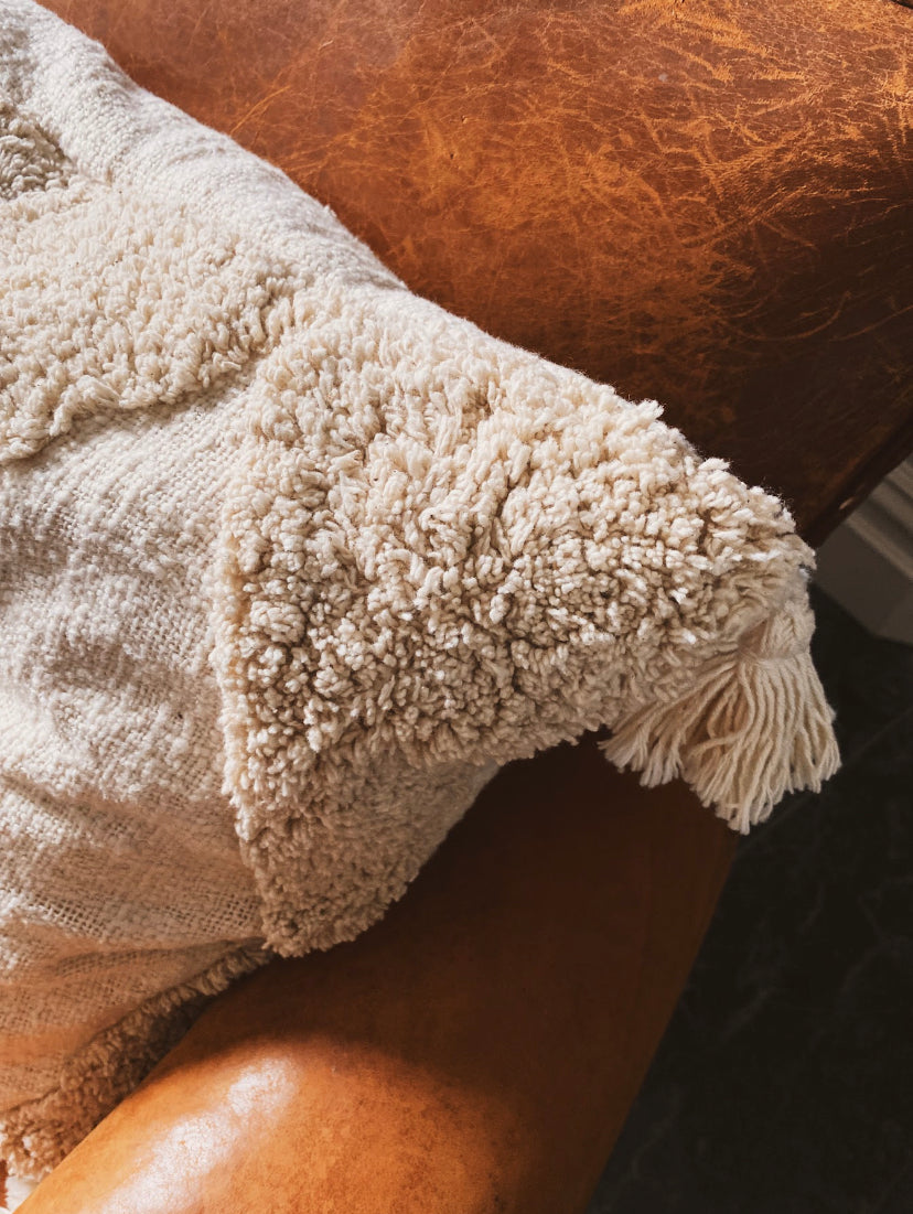 ivory cushion with tassels
