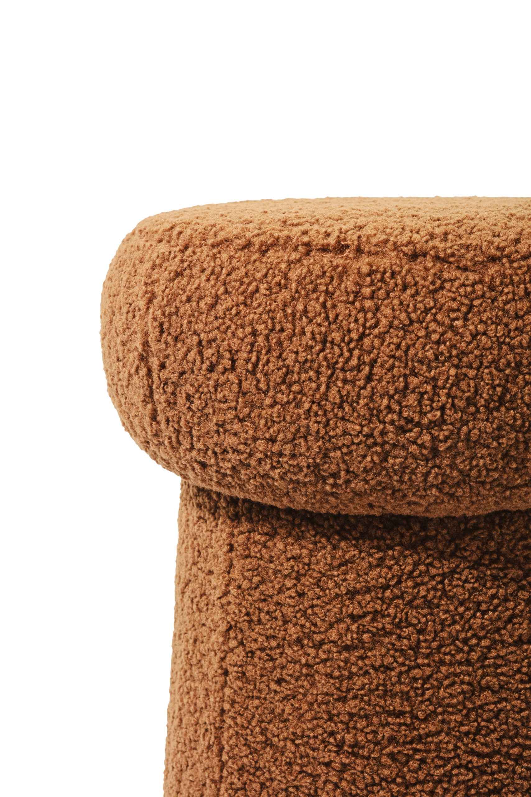 Detail of Rust Boucle Stool on white background