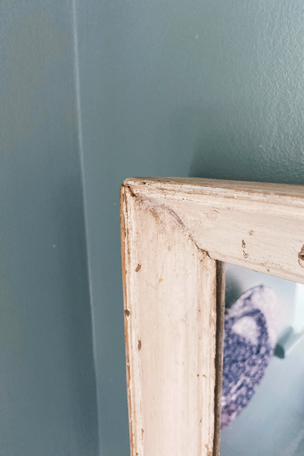 close up detail of white reclaimed wood mirror frame